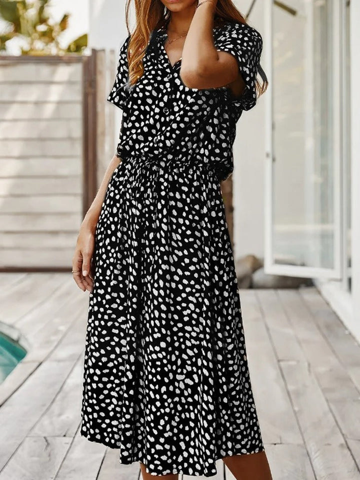 Robe chemise midi élégante et confortable. Coupe fluide, idéale pour toutes occasions.
