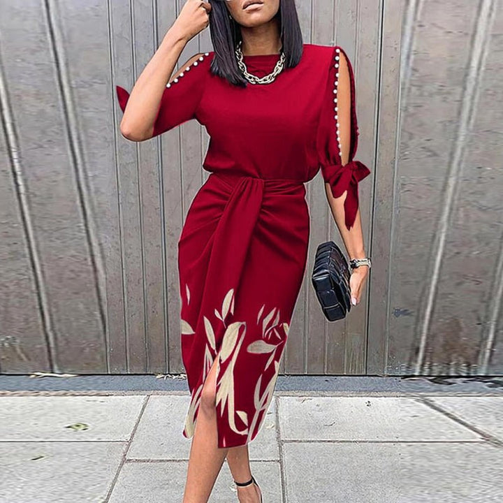 Robe de cocktail femme en tissu fluide, imprimé floral vibrant, idéale pour toute occasion.
