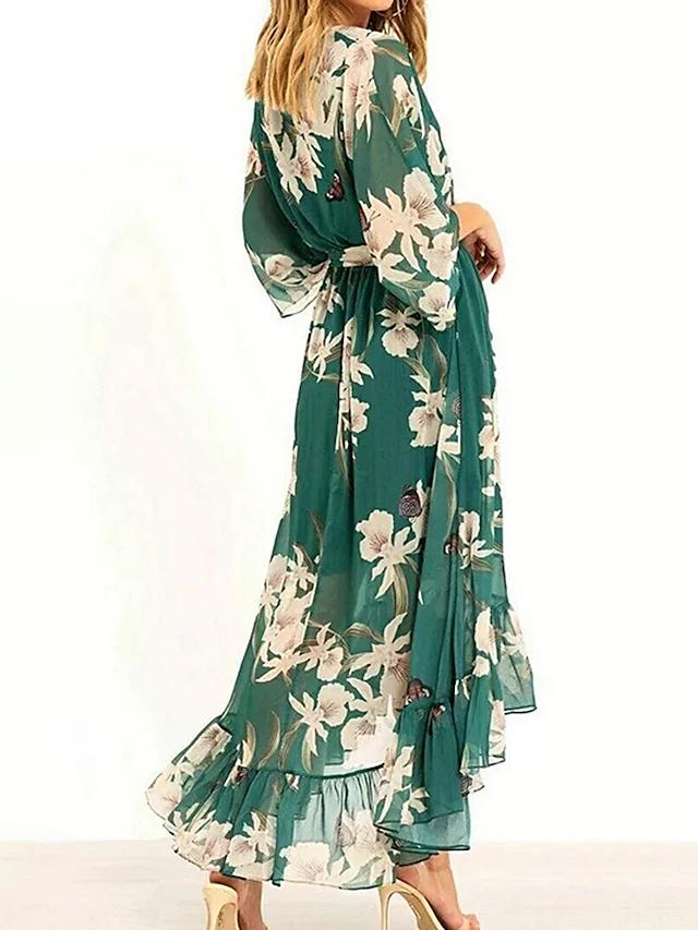 "Robe cocktail verte élégante avec volants et ceinture, parfaite pour occasions spéciales, style sophistiqué et flatteur."