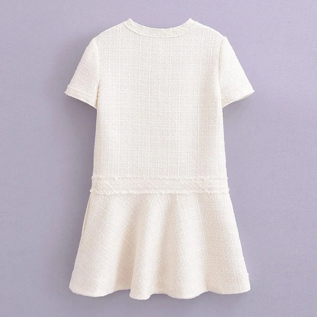 Robe courte été, col rond, texture élégante.  Coupe flatteuse et confortable.  Parfait pour l'été.