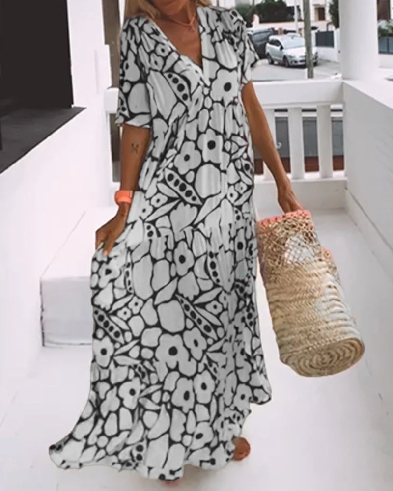 Robe estivale femme, décontractée élégante, avec imprimé unique et col en V. Parfaite pour toute occasion estivale.