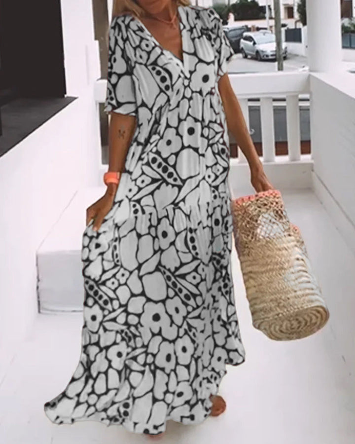 Robe estivale femme, décontractée élégante, avec imprimé unique et col en V. Parfaite pour toute occasion estivale.