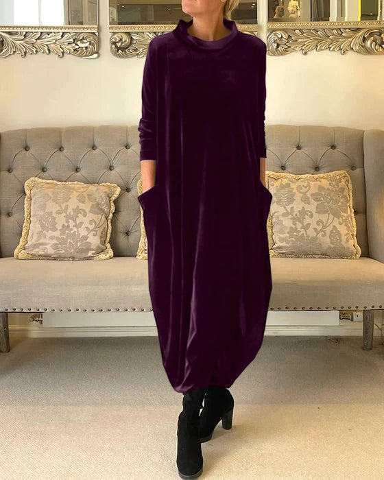 Robe d'hiver pour femmes, design chic à manches longues, offrant chaleur et style. Idéale pour une tenue soirée hivernale.