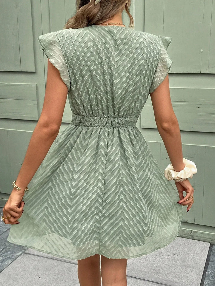 Robe courte d'été abricot femme, taille élastiquée. Style léger et bohème chic pour les vacances. Parfaite pour l'été.