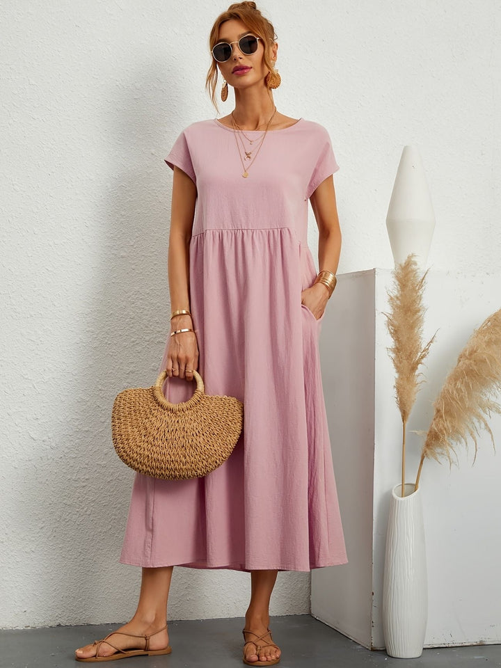 Robe décontractée femme, col rond. Parfaite pour l'été, polyvalente et très chic.