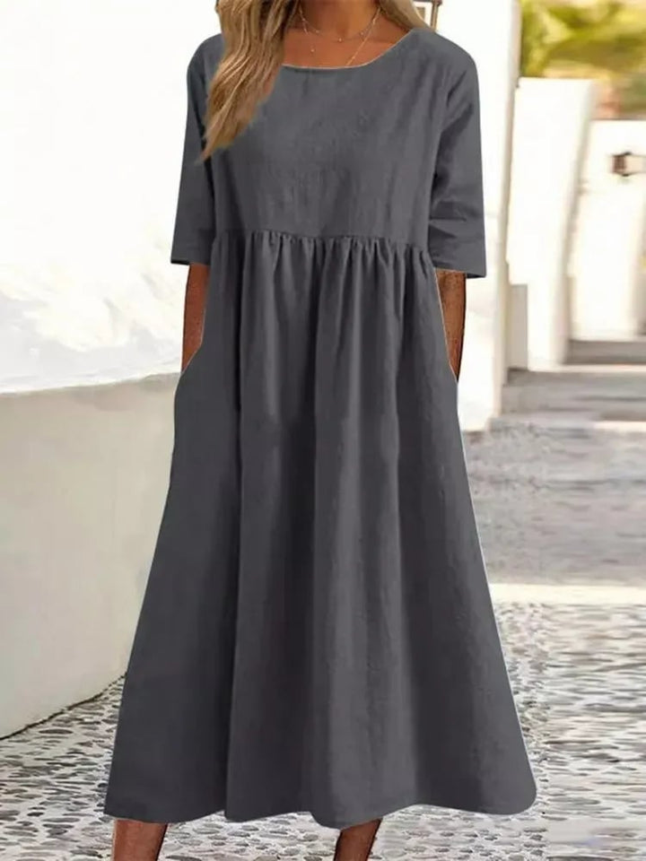 Magnifique robe d'été décontractée Ivanna pour femme, combinant confort et style chic pour l'été.