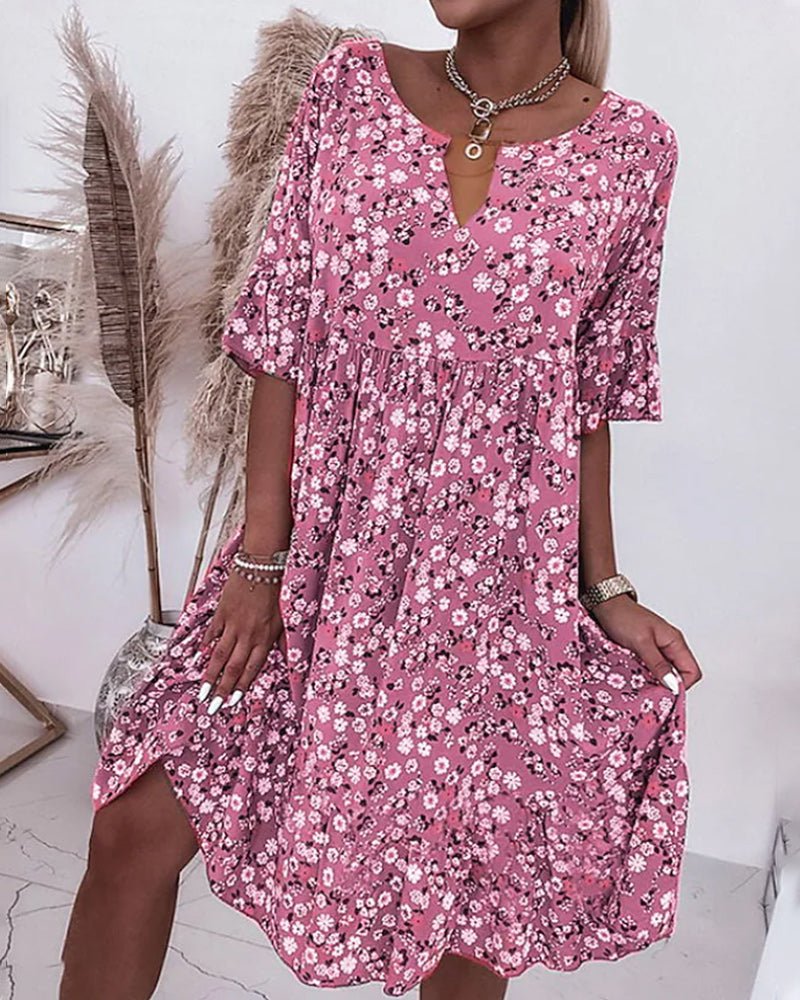Robe d'été fleurie élégante pour femme, design aérien et confortable, parfaite pour les vacances printemps-été.