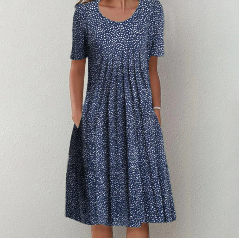 Robe d'été fleurie pour femme, polyvalente, avec poches, parfaite pour les journées chaudes et soirées printanières.