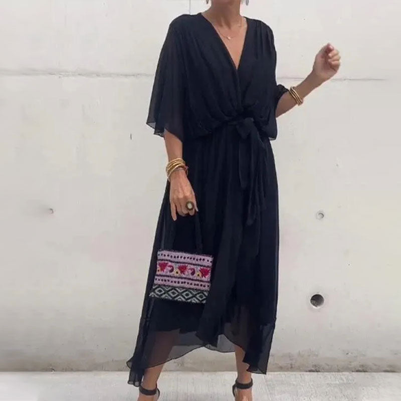 Robe d'été midi fluide femme, élégante et confortable, parfaite pour les chaudes journées estivales.