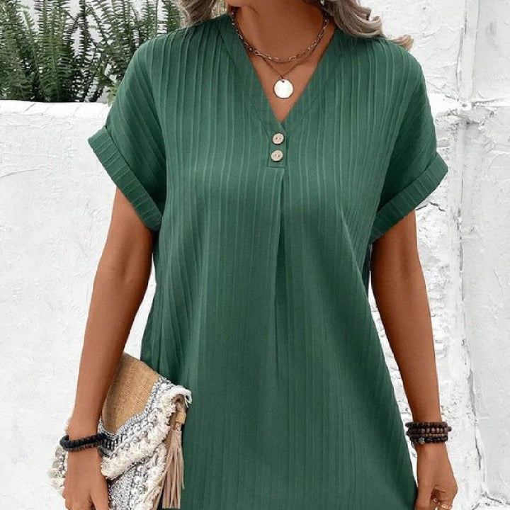 Robe femme estivale midi, coupe élégante et confortable, parfaite pour le bureau ou une sortie.