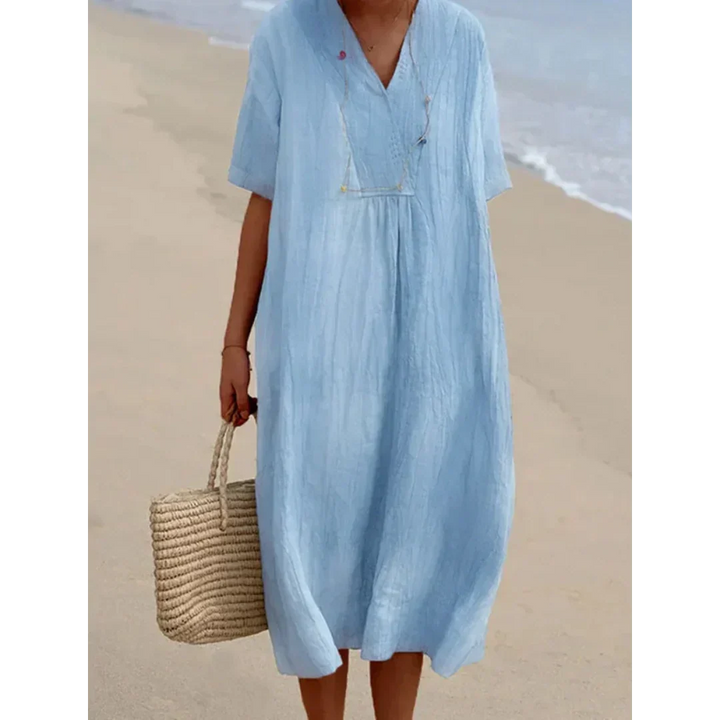 Robe de plage fluide midi pour femmes, élégance estivale décontractée. Parfaite pour l'été chic et confortable.