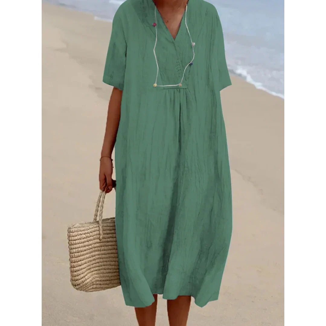 Robe d'été femme, coupe midi fluide, parfaite pour une allure élégante et décontractée à la plage ou en ville.