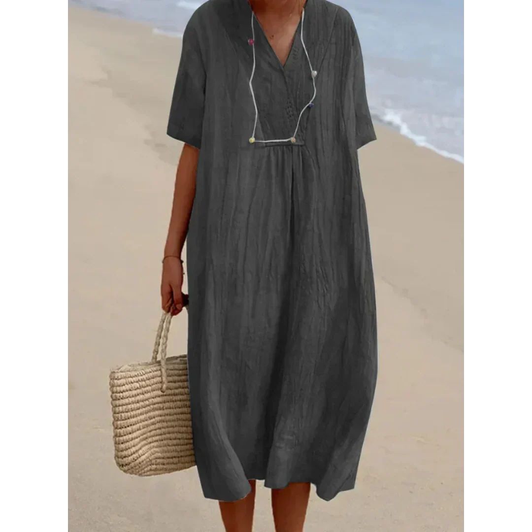 Chic robe midi fluide pour femmes, indispensable pour l'été. Confortable et élégante pour la plage et le quotidien.