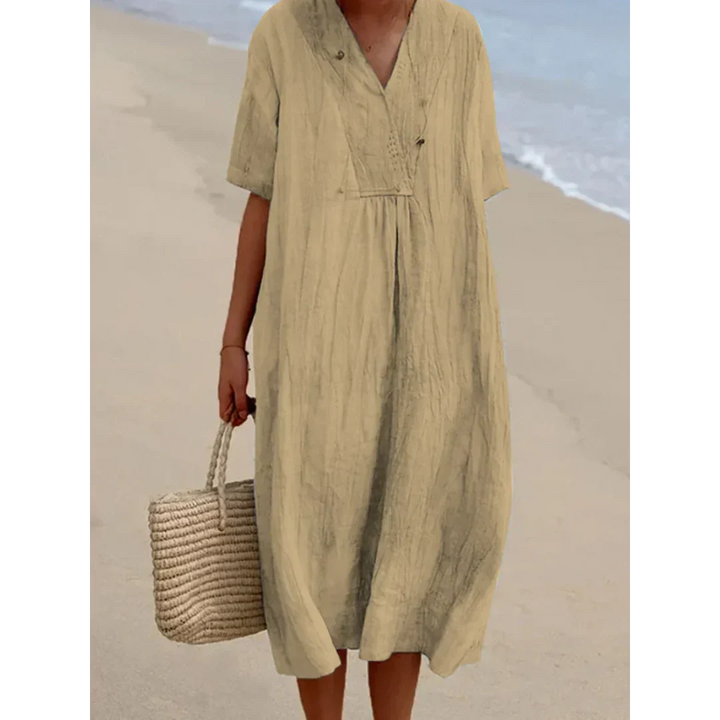 Robe de plage estivale fluide et midi pour femme. Apportez élégance et confort à vos journées d'été décontractées.