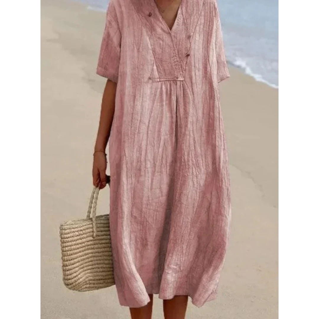 Robe fluide décontractée midi pour femmes, style chic et confortable. Idéale pour la plage et vos vacances d'été.