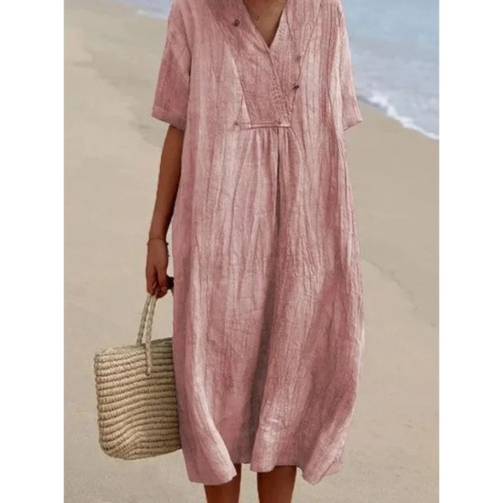 Robe fluide décontractée midi pour femmes, style chic et confortable. Idéale pour la plage et vos vacances d'été.