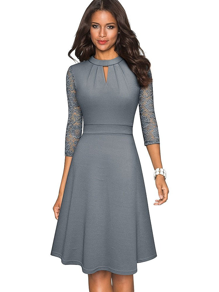 Robe habillée femme moderne avec décolleté évidé, idéale pour soirée chic ou événement spécial.