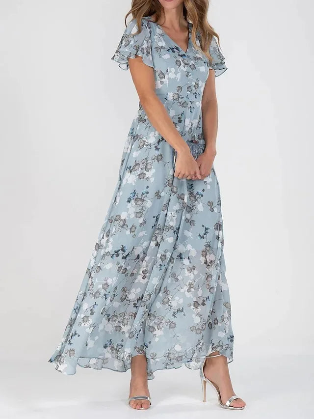 Robe d'été colorée, coupe élégante et flatteuse.  Idéale pour toutes les occasions.