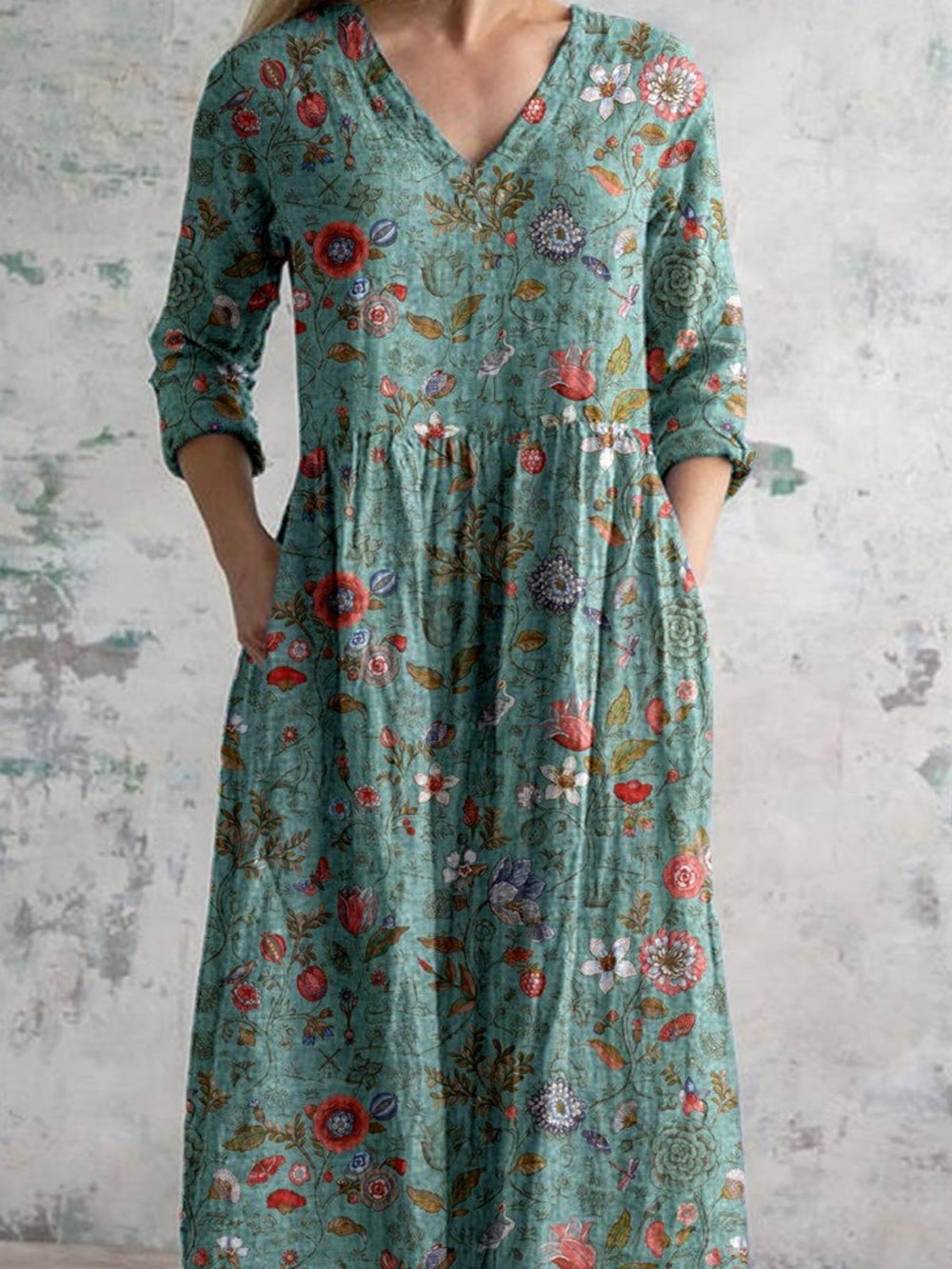 Robe d'été verte élégante et légère, idéale pour les journées chaudes.