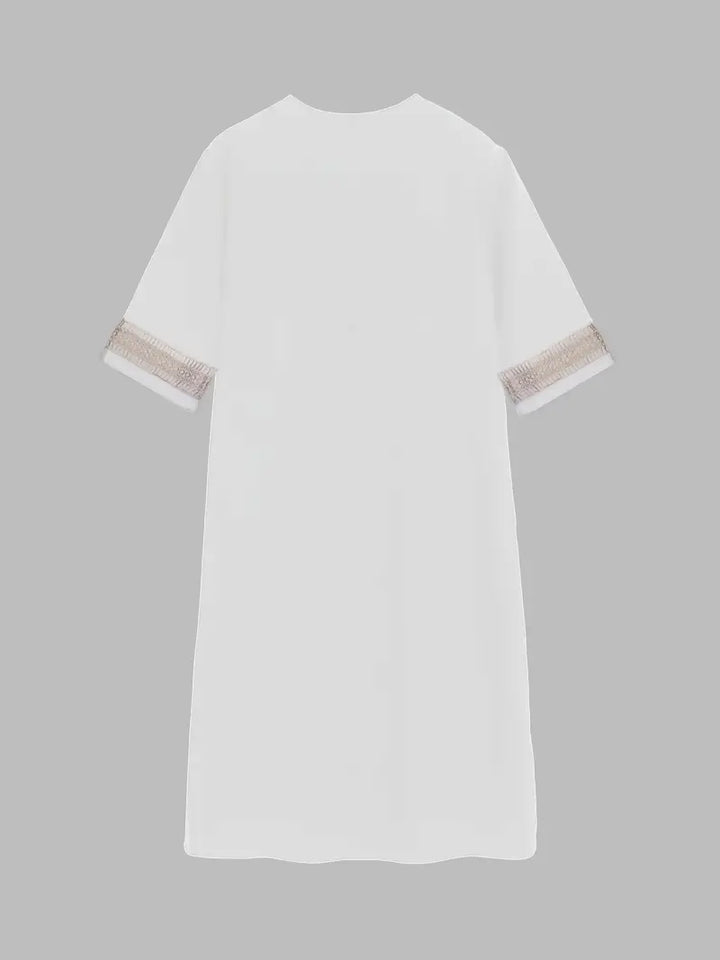Robe d'été crochet, style fluide et léger.  Détail crochet raffiné. Parfaite pour l'été.