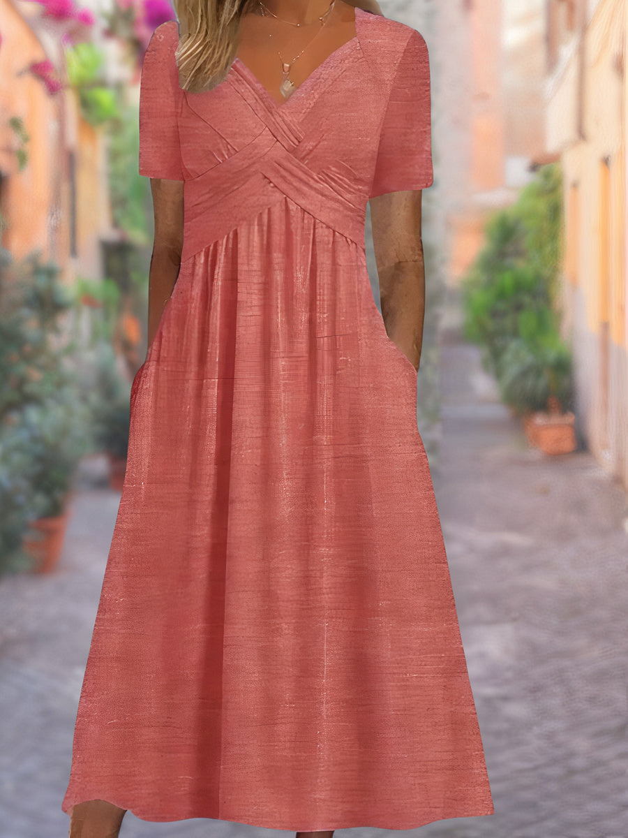 "Robe d'été féminine avec décolleté en V, manches courtes et silhouette portefeuille, confortable et élégante."