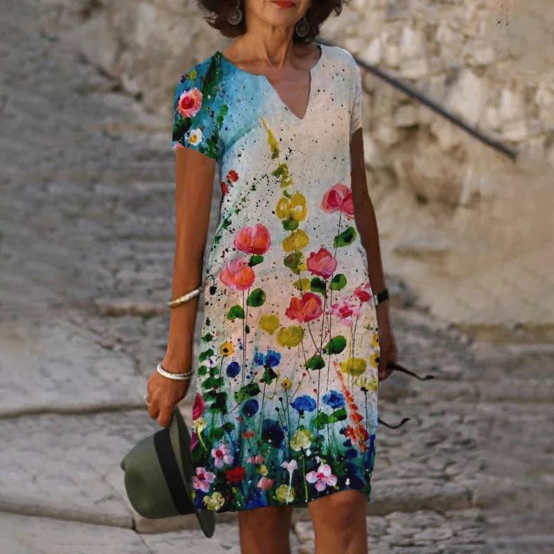 "Robe d'été fleurie Isabelle, légère et élégante, vue de face, avec coupe fluide et imprimé floral chic pour l'été."