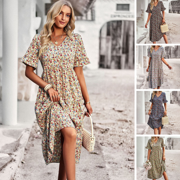 "Robe d'été fleurie vivante, tissu léger, imprimé floral vibrant, couleur abricot, parfaite pour sorties ensoleillées."