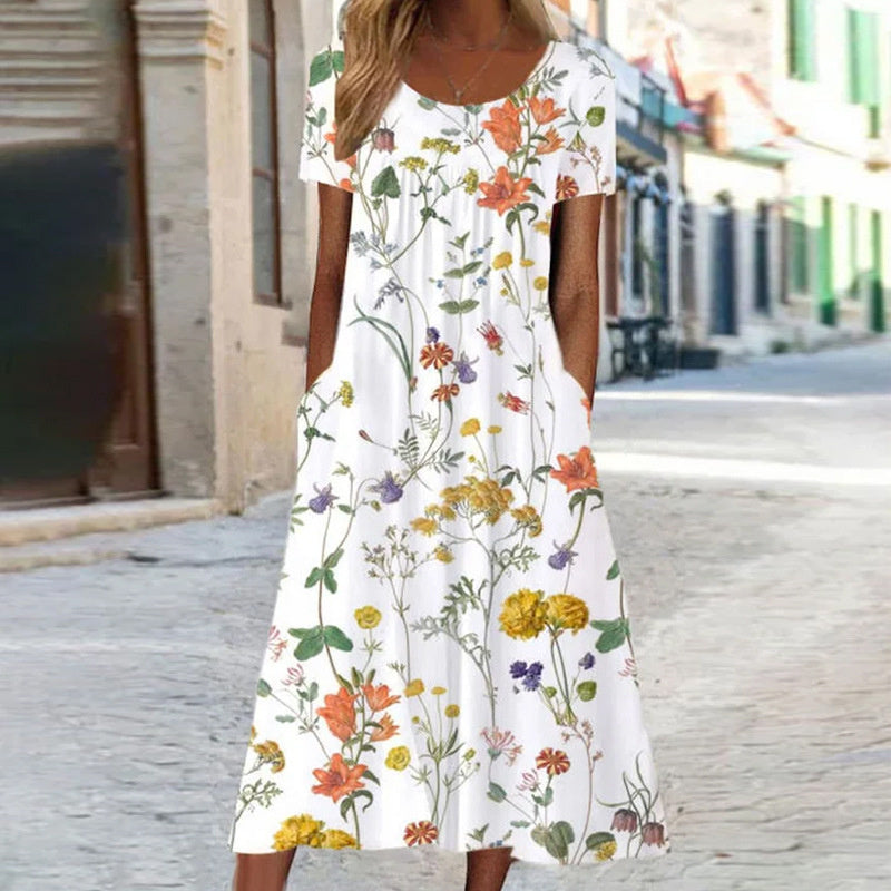 Robe d'été fluide, coupe élégante et confortable.  Motif floral.  Idéale pour l'été.