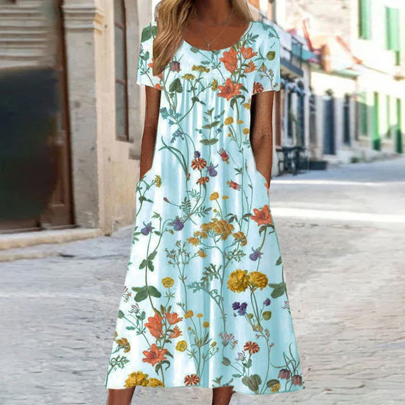Robe d'été fluide, coupe élégante et confortable.  Motif floral.  Idéale pour l'été.