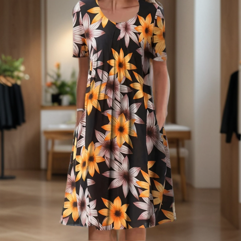 Robe d'été fluide, manches 3/4, imprimé élégant.  Coupe ample et confortable.