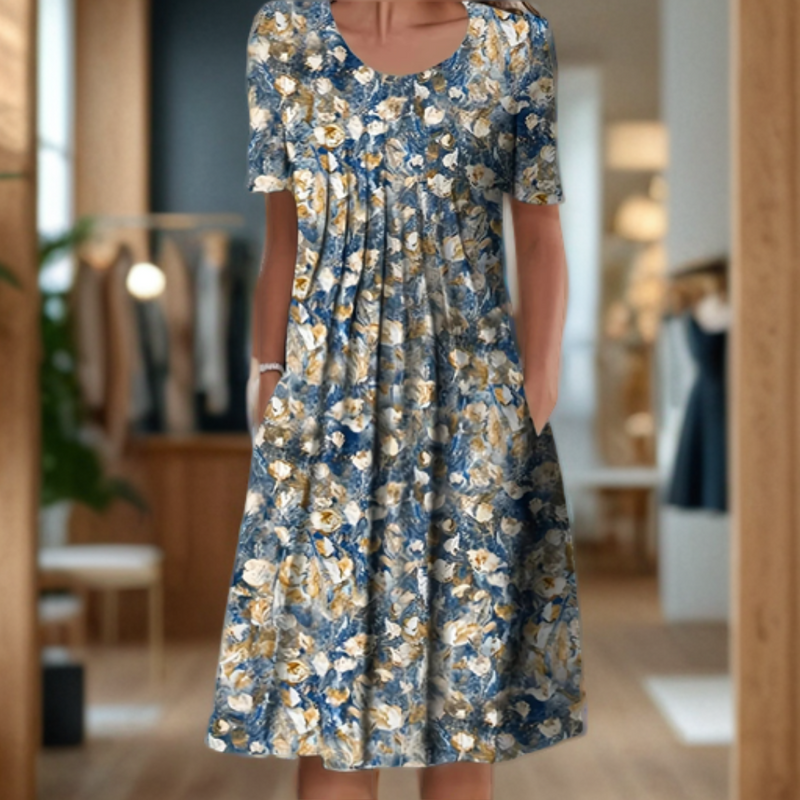 Robe d'été fluide, manches 3/4, imprimé élégant.  Coupe ample et confortable.