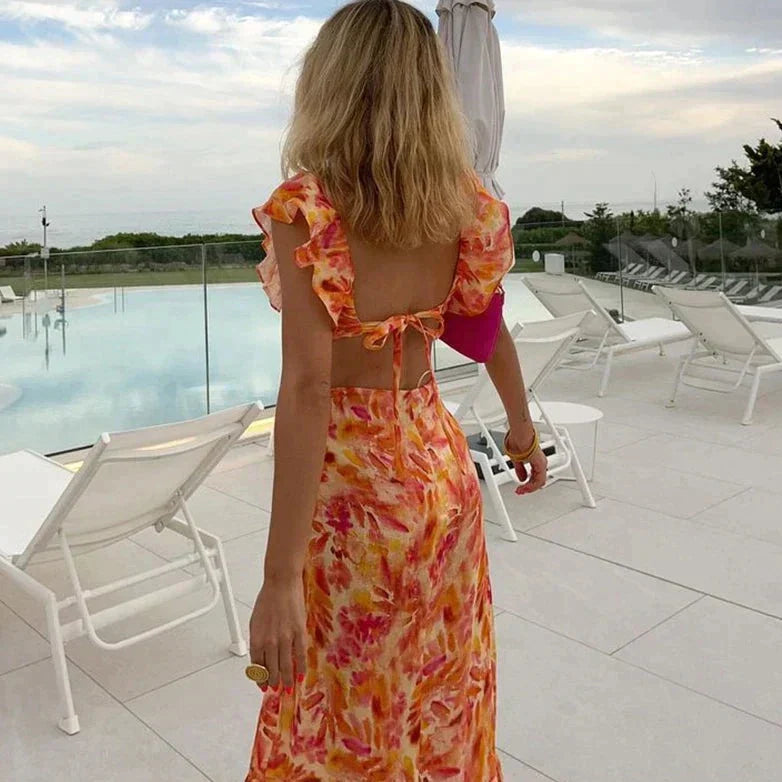 Robe d'été imprimée, volants, coupe chic et féminine.  Parfait pour l'été.