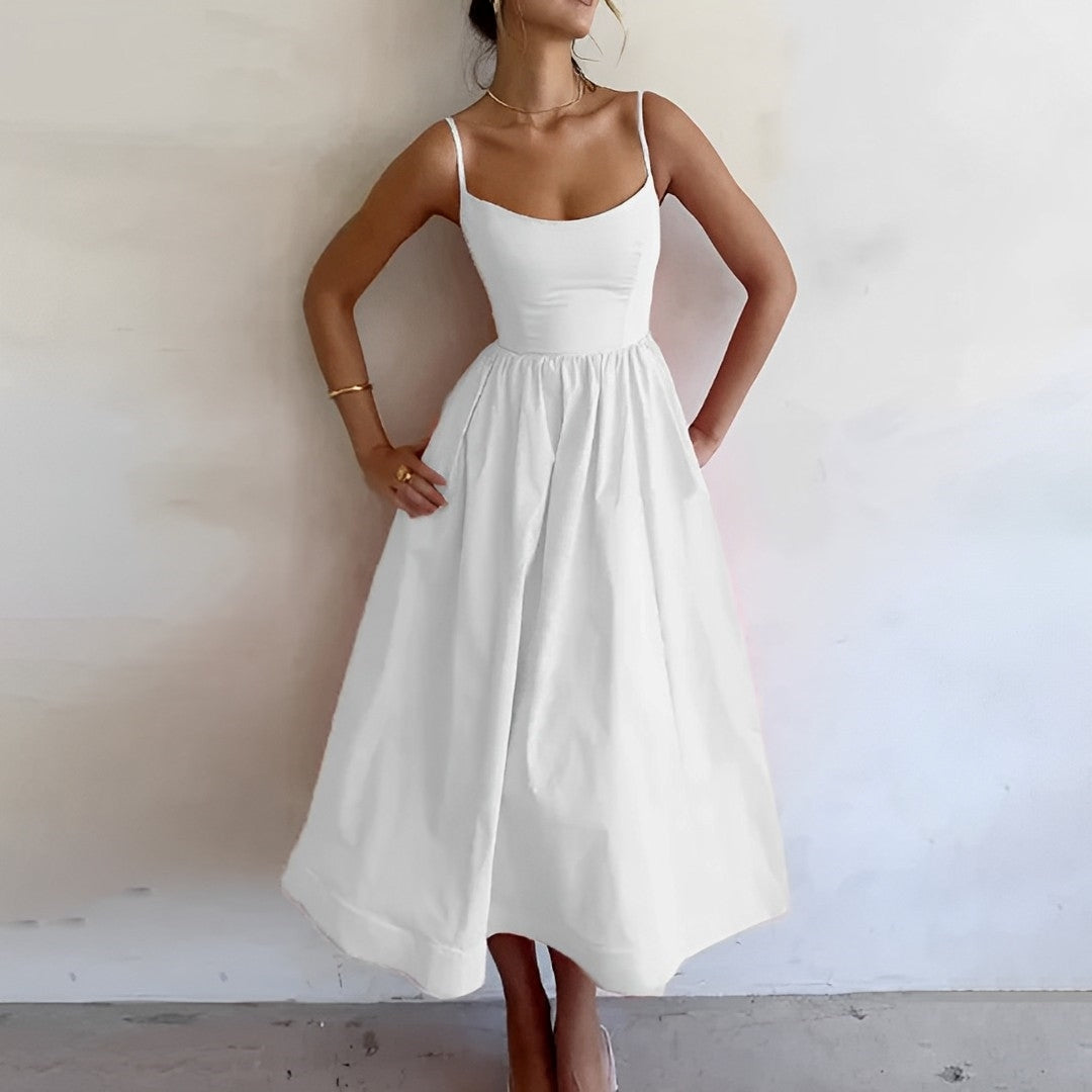 Robe d'été midi élégante sans manches, ligne A, flatteuse, intemporelle, féminine, idéale pour sorties estivales.