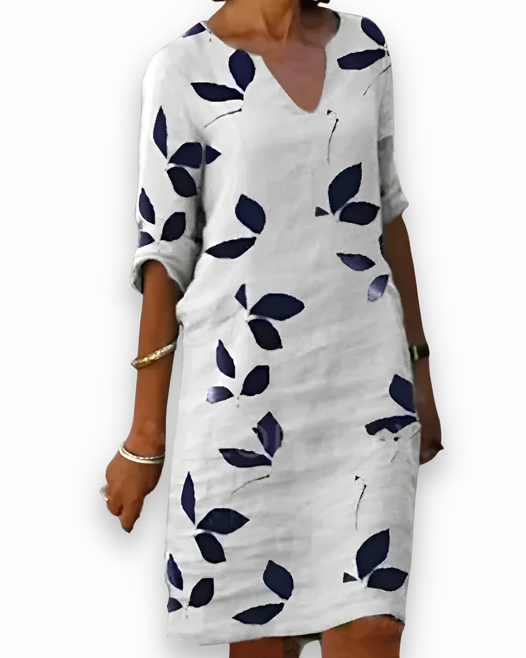 "Robe élégante femme, tissu fluide, motif feuilles vertes, col en V, coupe estivale pour confort et style sophistiqué."