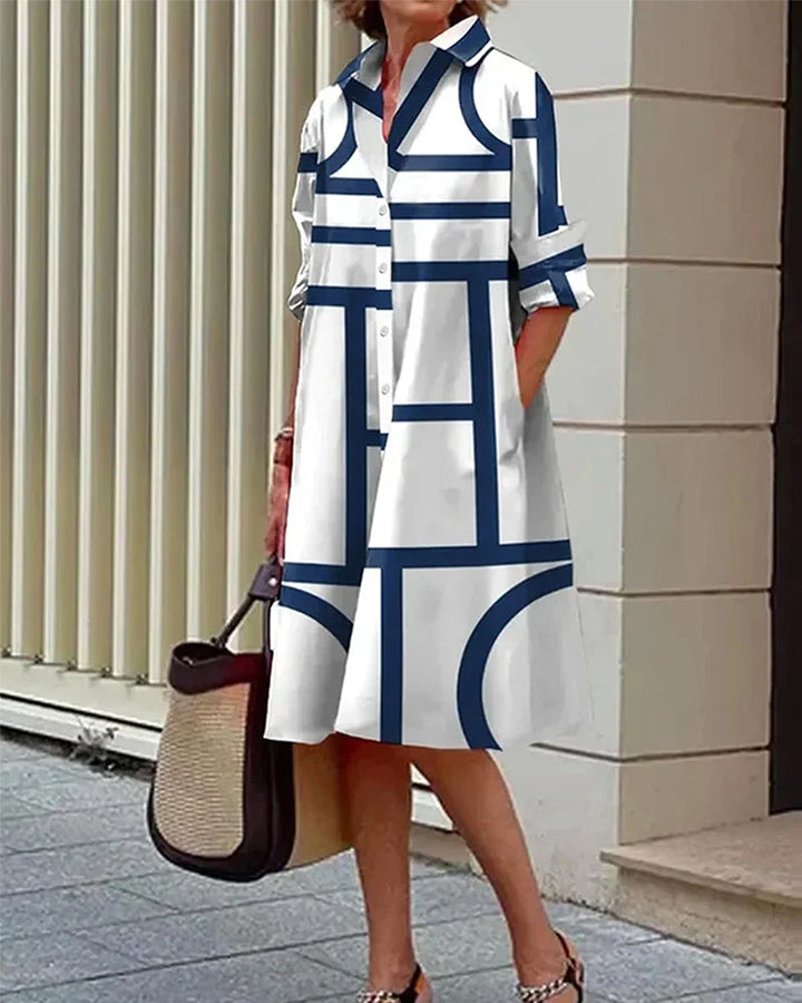 Robe élégante, imprimé géométrique, poches.  Coupe flatteuse et confortable.  Idéale pour toutes occasions.