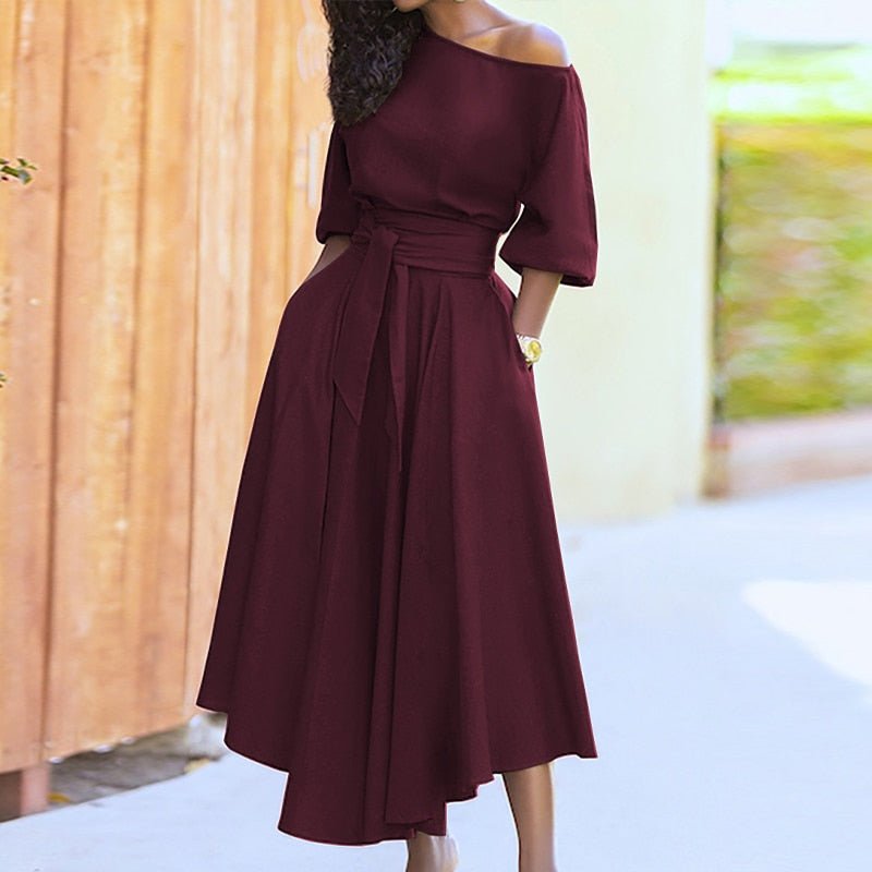 "Robe élégante pour femme en coton, taille cintrée, style intemporel, couleur douce, parfaite pour toutes occasions."