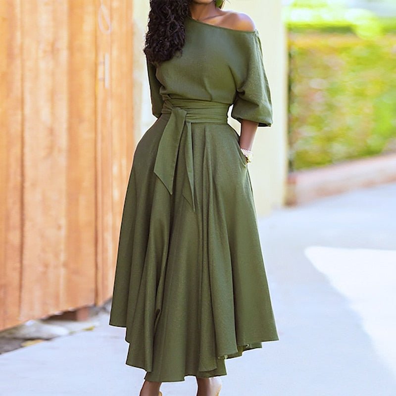 "Robe élégante pour femme en coton, taille cintrée, style intemporel, couleur douce, parfaite pour toutes occasions."