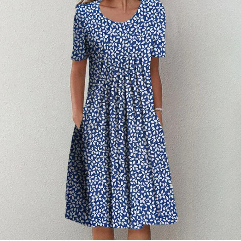 Robe été fleurie, coupe fluide et élégante.  Motif floral estival.  Parfait pour les occasions spéciales et le quotidien.
