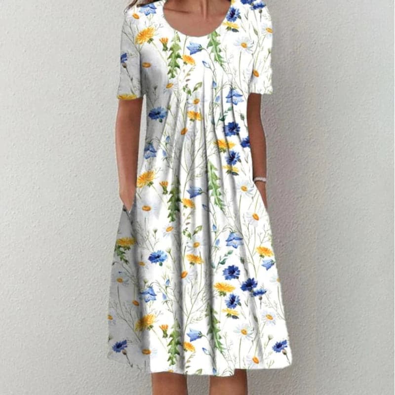 "Robe évasée midi à imprimé floral, manches courtes, décolleté doux, tissu léger, silhouette flatteuse, confort estival"