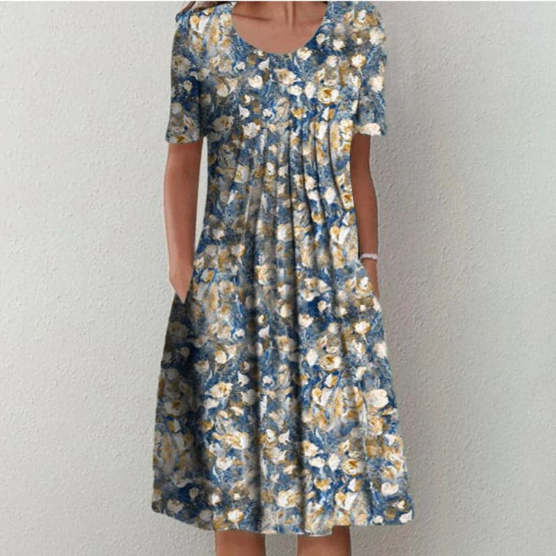 "Robe évasée midi à imprimé floral, manches courtes, décolleté doux, tissu léger, silhouette flatteuse, confort estival"