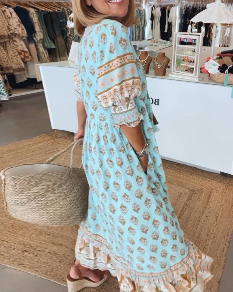Robe femme élégante Tallulah imprimée, col V, manches mi-longues. Idéale tenue chic décontractée et polyvalente.