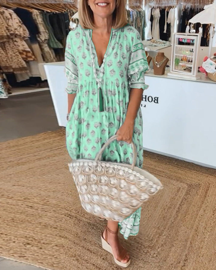 Robe femme imprimée Tallulah, col en V, manches mi-longues fluides. Élégante, pour un look polyvalent.