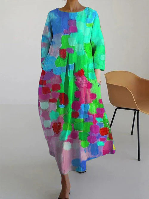 Robe femme légère Antonella à motif floral estival. Coupe fluide et couleurs vives (bleu, jaune) pour l'été.