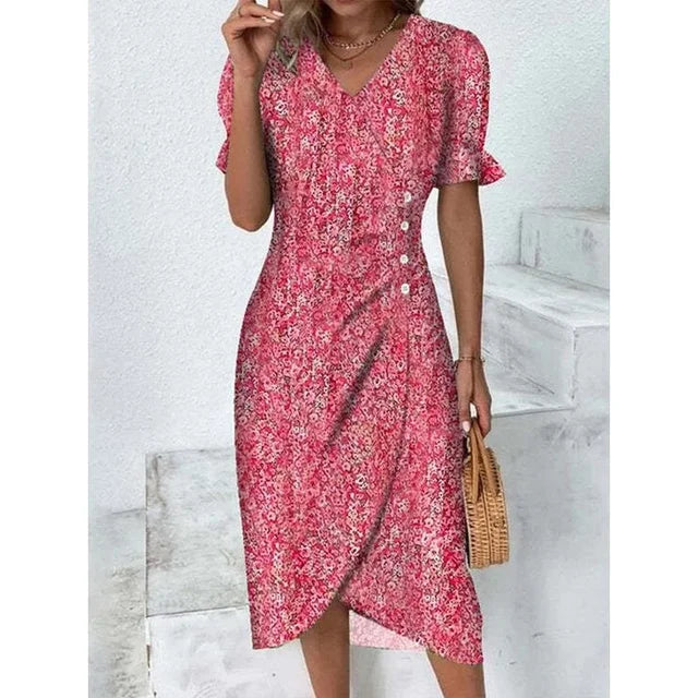 Robe fleurie élégante avec motifs floraux, coupe flatteuse et tissu léger. Idéale pour un look féminin et sophistiqué.