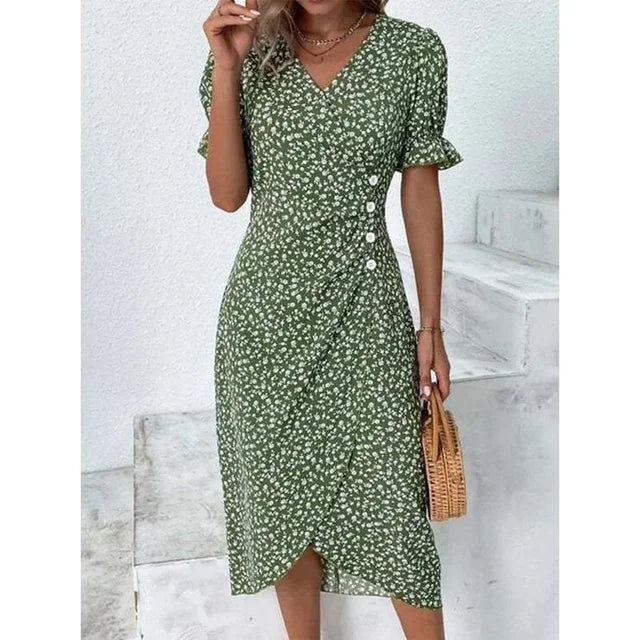 Robe fleurie élégante avec motifs floraux, coupe flatteuse et tissu léger. Idéale pour un look féminin et sophistiqué.