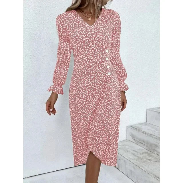 Robe fleurie élégante avec motifs floraux, coupe flatteuse et tissu léger. Idéale pour un look féminin et sophistiqué.