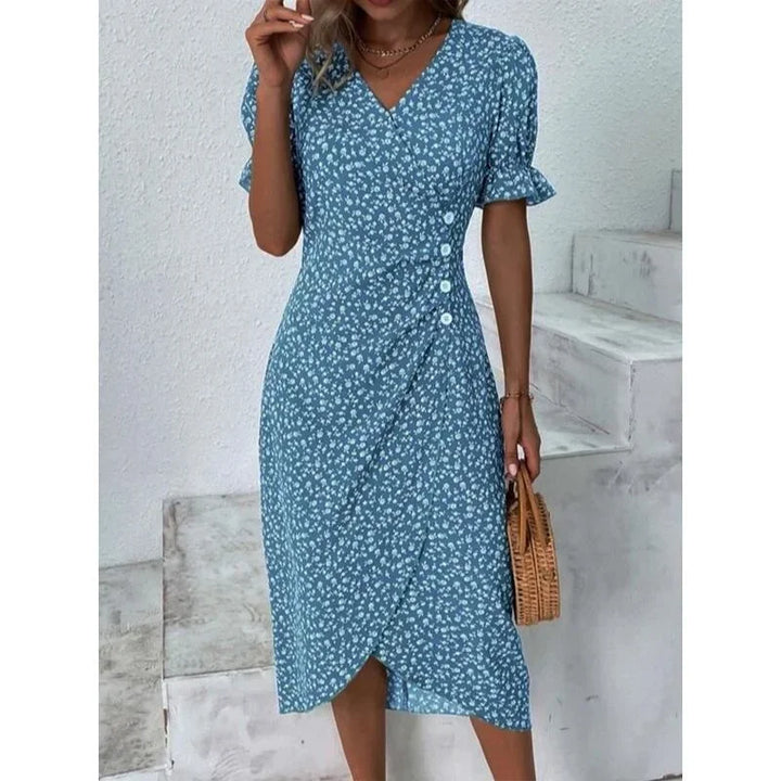 Robe fleurie élégante avec motifs floraux, coupe flatteuse et tissu léger. Idéale pour un look féminin et sophistiqué.