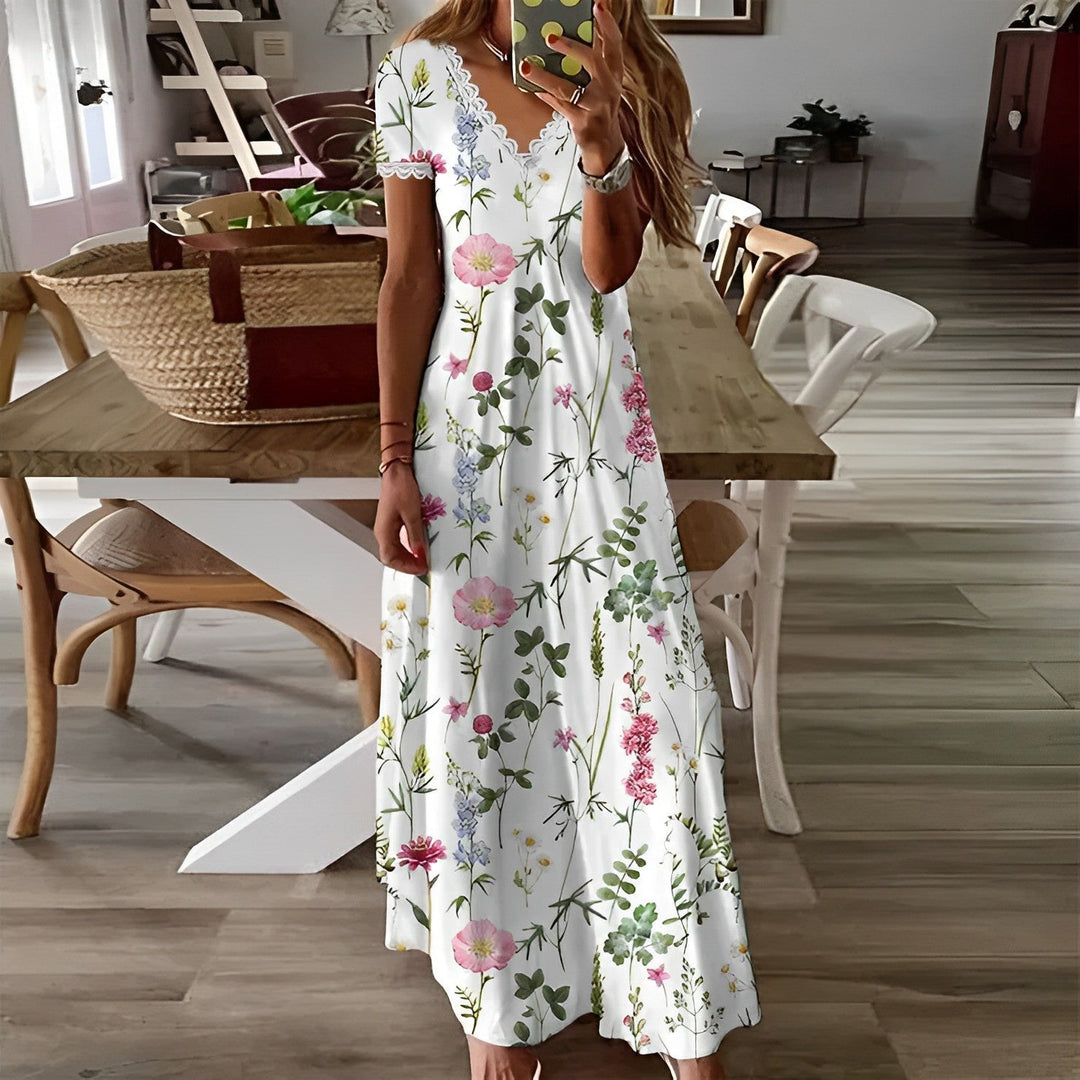 "Robe florale élégante pour femme, imprimé sophistiqué, coupe fluide, tenue légère et féminine adaptée à toutes occasions."