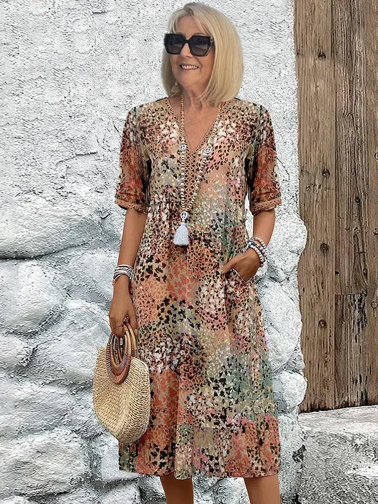 Robe florale fluide femme, motif printanier élégant, parfaite pour l'été.