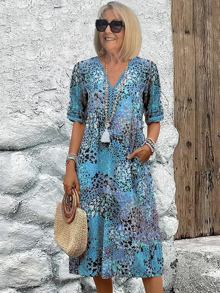 Robe fluide femme à motif floral chic, confortable et tendance pour le printemps-été.
